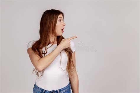 Woman Pointing Empty Space Showing Blank Wall For Commercial Idea