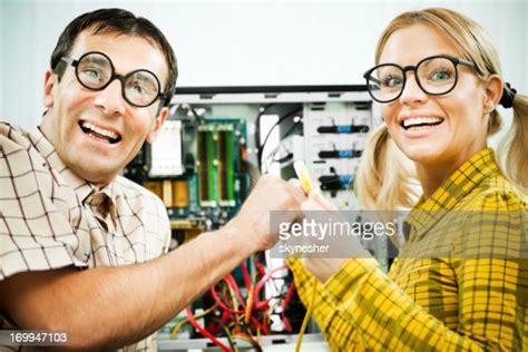 Two Geeks Fixing A Computer High Res Stock Photo Getty Images