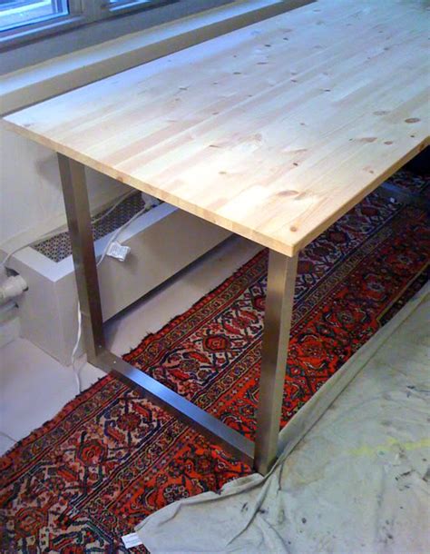 It's inspired by a pottery barn farmhouse table but only costs $100 to build. Easy DIY Desk With Ikea Table Tops and Legs