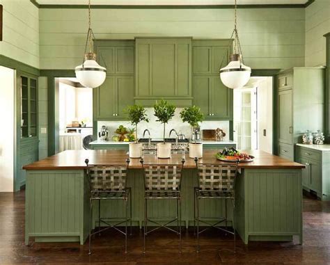 Moreover, this design involves farmhouse characteristics such as the rustic plate holder, reclaimed island table extension, and many flowery touches. Best Kitchen Countertops With Sage Green Cabinets | Kitcheniac