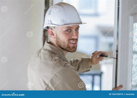 Smiling Male Builder Fixing Window Stock Image Image Of Handle