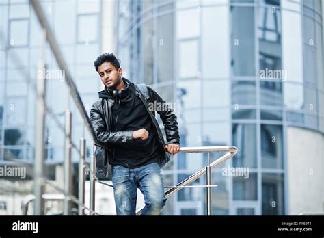 Stylish And Casual Asian Man In Black Leather Jacket Posed Near The