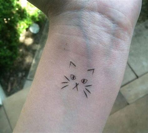 simple cat face tattoo on wrist cat tattoo designs cat outline tattoo tattoos