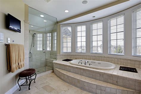 Modern Bathroom Centered Around Large Window Side Tub Built Into Raised