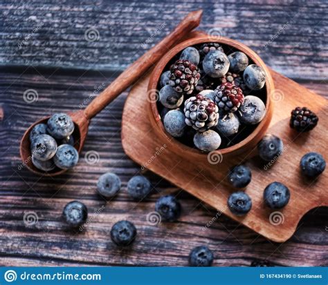 Fresh Blueberries And Blackberries In A Wooden Bowl Stock Photo Image