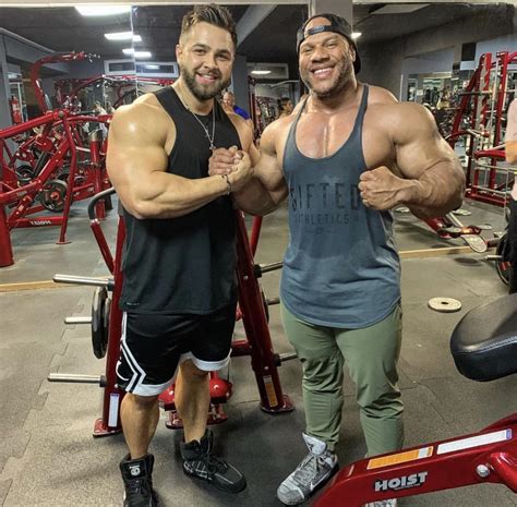 Regan Grimes Standing Next To Some Guy In The Gym Bodybuilding