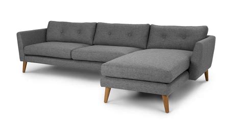 A Modern Spin On The Classic Button Tufted Sofa Featuring Flared Arms