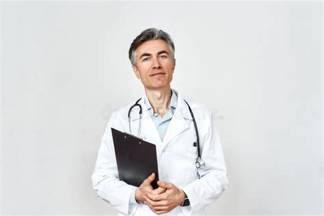Happy Doctor Portrait Of Professional Mature Doctor In Medical Uniform