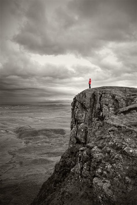 Young Woman Standing On The Edge Of A Cliff Photograph By Leander Nardin