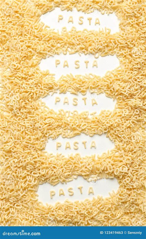 Composition With Raw Alphabet Pasta On White Background Stock Image