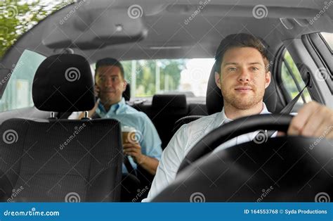 Male Taxi Driver Driving Car With Passenger Stock Photo Image Of