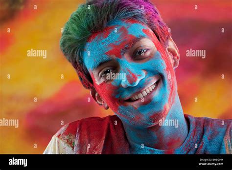 Mans Face Covered In Holi Colours Stock Photo Alamy