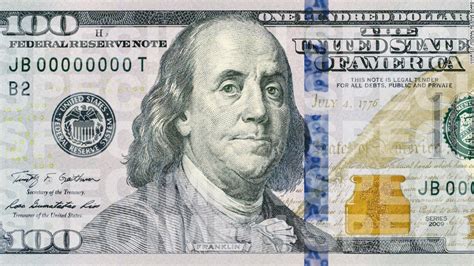 The american usa dollar bill banknote green money that is an international economy currency. New $100 bill debuts