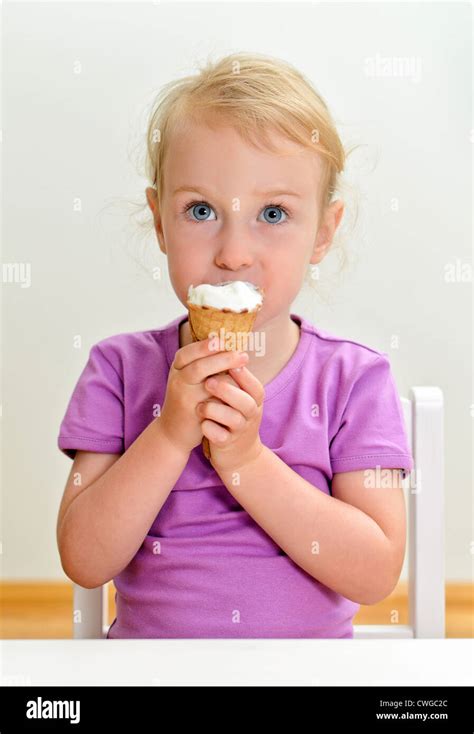 Cute Little Girl Eating Ice Cream Stock Photo Alamy