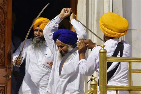 Sikhs Wield Swords During Their Clash The Golden Temple Mirror Online