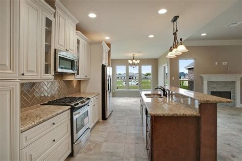 We replaced all of the kitchen cabinets, appliances and countertops. G2-Ivory White Cabinet & Dark Caramel Kitchen Island ...
