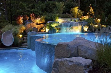 Modern home with indoor pool and sauna room. Fancy Stone Inground Pool Water Slide | vanishing-edge ...