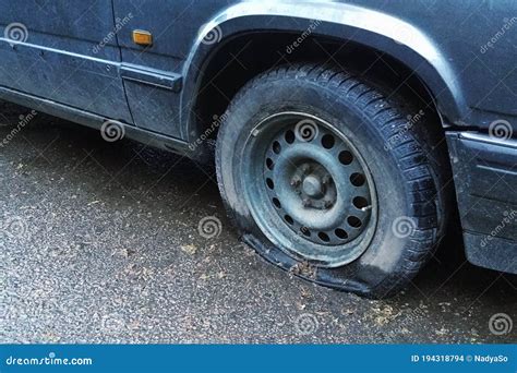 Old Car With Flat Tyre On The Street Closeup Stock Photo Image Of