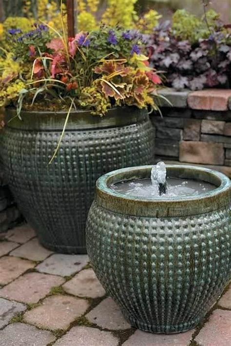 The terra cotta material gives the homemade water fountain a natural look so it blends in well with any surrounding landscape. 214 best images about DIY Water Fountains on Pinterest ...