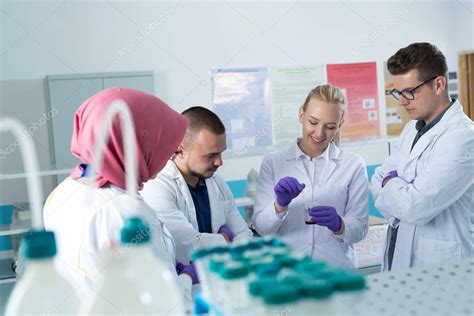 Group Of Scientists Working At The Laboratory — Stock Photo © Myvisuals