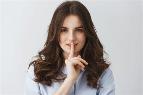 Free Photo Close Up Of Young Sexy Girl Holding Finger Near Mouth Making Hush Gesture With