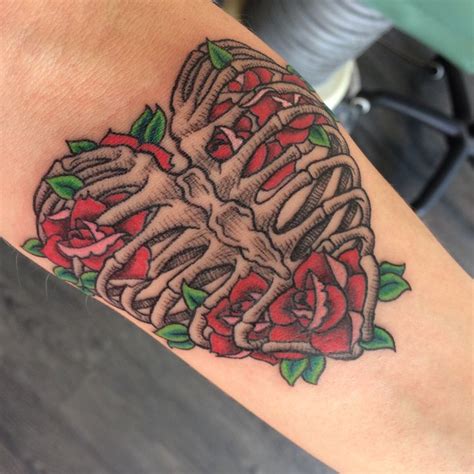 Intricate Rib Cage Tattoo With Heart And Roses