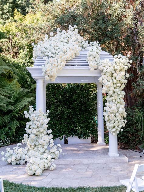White Flowers Decorating Ceremony Arbor White Roses Wedding White