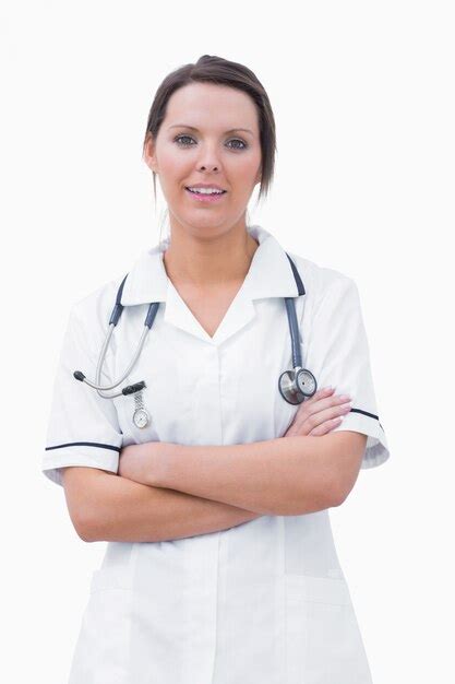 Premium Photo Portrait Of Smiling Nurse Standing With Arms Crossed