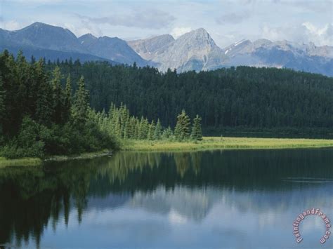 Raymond Gehman A Beautiful Mountain Scene Reflected In A Peaceful