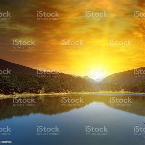 Sunrise Over Lake And Mountains Stock Photo Download Image Now Bay