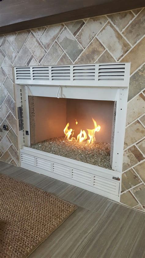 Maybe you would like to learn more about one of these? Gas fireplace, champagne fireglass, industrial brick tile ...
