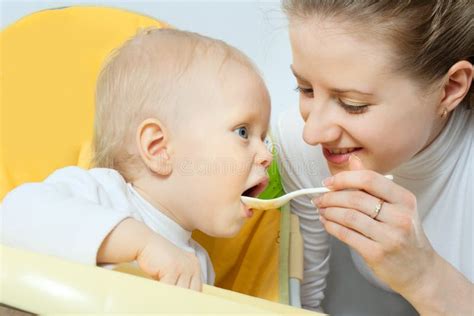 Mother Feeding Her Baby Royalty Free Stock Image Image 12946316