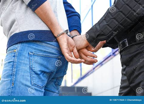 Police Officer Putting Handcuffs On Criminal Outdoors Stock Photo Image Of Inspector Illegal