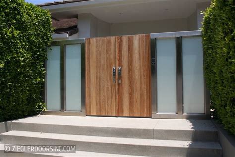 An Entrance To A House With Wooden Doors