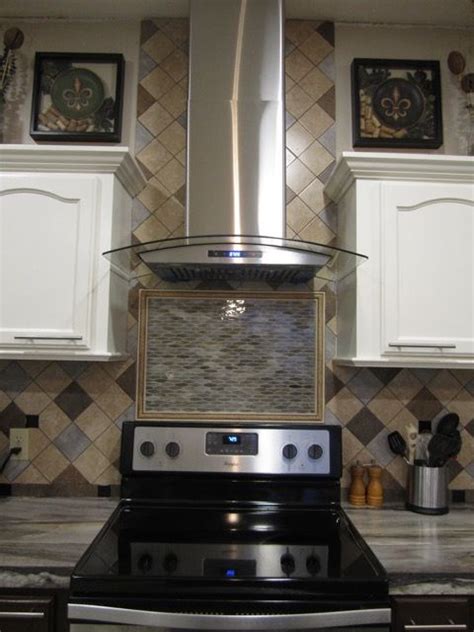 Doesn't the tile change the entire look of the kitchen? The vent hood area tiling is complete. It looks so much ...