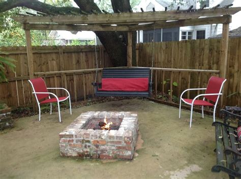 Find a fire pit table for every application. Triangle gazebo with brick fire pit | Pergola designs ...