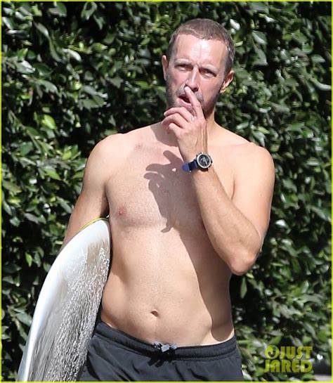 Chris Martin Goes Shirtless While Surfing In Malibu Photo