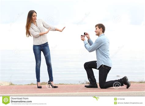 Start trying to change the way you act around her. Proposal Rejection When A Man Asks In Marriage To A Woman Stock Photo - Image of beach, hands ...