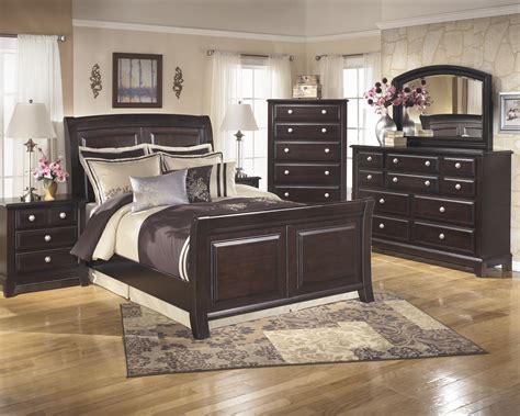 I'm a fan of symmetry in design, especially matching nightstands that flank a bed. Ridgley 3-Piece Sleigh Bedroom Set in Dark Brown ...