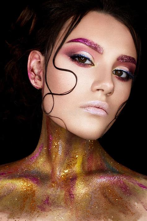 A Young Girl With Creative Makeup And Shiny Eyebrows Beautiful Model
