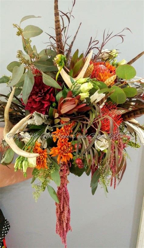 Inspirational flower ideas for romantic weddings. A rustic bouquet of beautiful flowers and foliage with ...