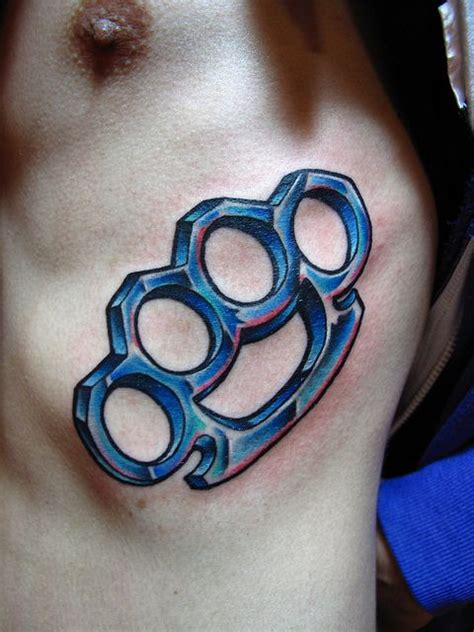 Beautifully Crafted Brass Knuckles Tattoo On Display