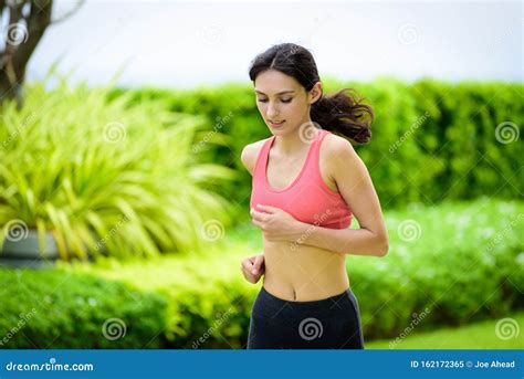 Beautiful Woman Runner Has To Warm Up In The Garden Stock Image Image Of Beautiful Running