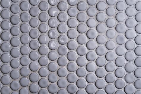 White Ceramic Tile Wall With Many Small Round Unique Pattern Top View