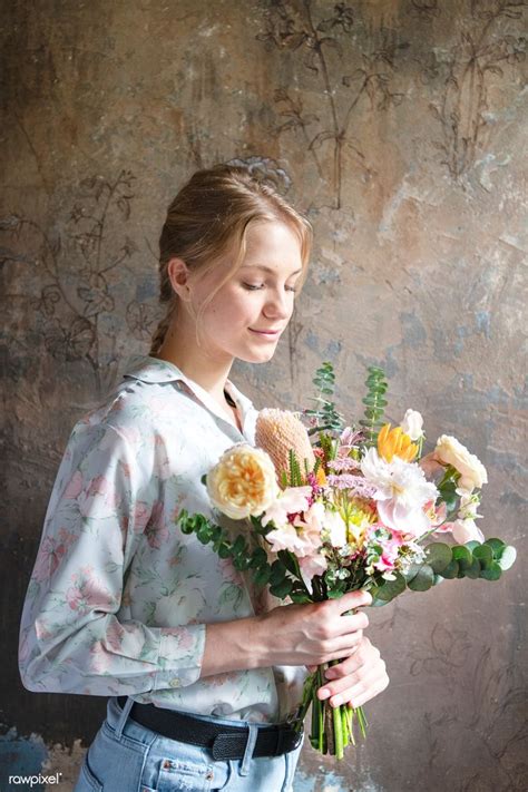 Download Premium Image Of Woman Holding A Bouquet Of Flowers 1207115