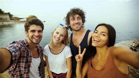 Young People Taking Selfies On The Beach Stock Video Footage Storyblocks