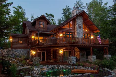 A Hybrid Log Chalet On A Walk Out Basement With Stone Fireplace In The
