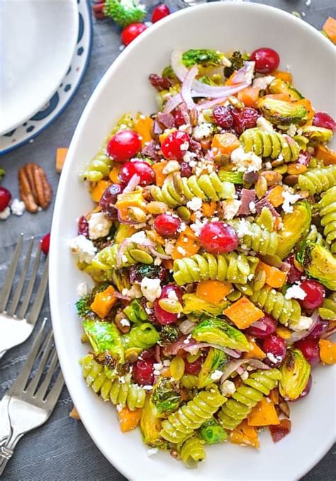 Enjoy this veggie pesto pasta salad with cucumber, peas, cherry tomatoes and basil for an easy family meal. Easy Fall Pasta Salad - Christmas Pasta Salad Recipe