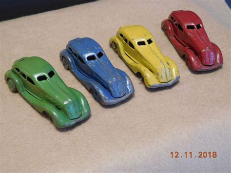 4 Vintage Tin Penny Toy Cars Made In Japan Blue Red Green Yellow All