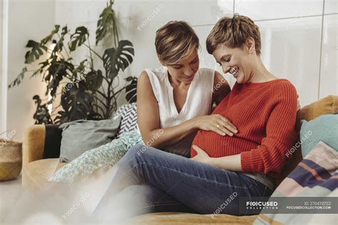 Happy Lesbian Couple Touching Belly Of The Expectant Mother — Short